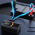 nomado Gonfleur de Pneu & Booster de Batterie Voiture Portable 2-en-1 avec lumières bleues et écran numérique sur une surface sombre